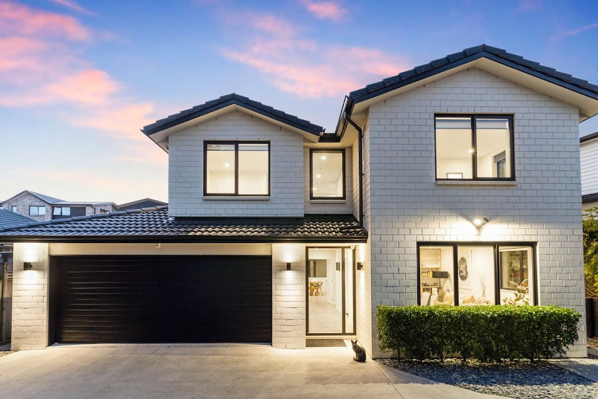 Highgate standalone home, two-storey, white weatherboard at dusk.
